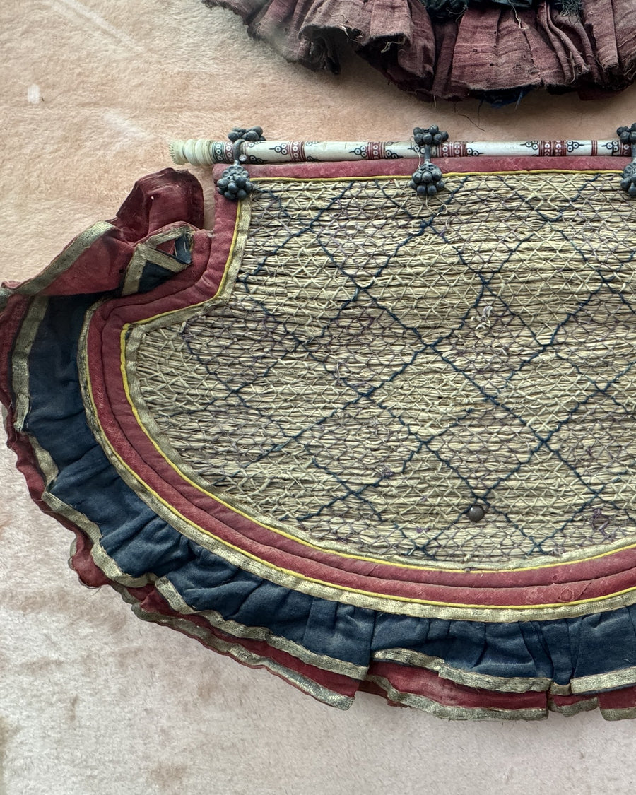 Zari net with a stitched dark lattice and a scalloped border