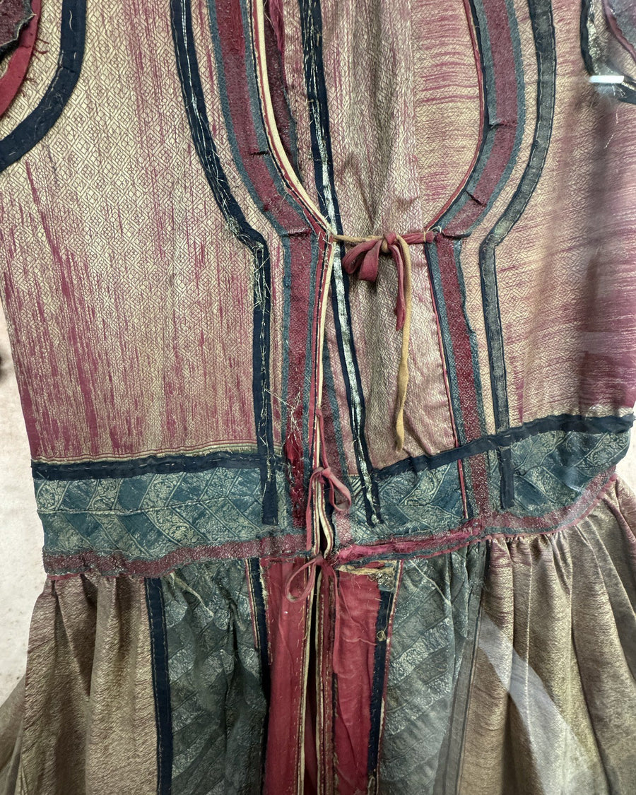 Woven zari ground with couched silk borders and a silk tie