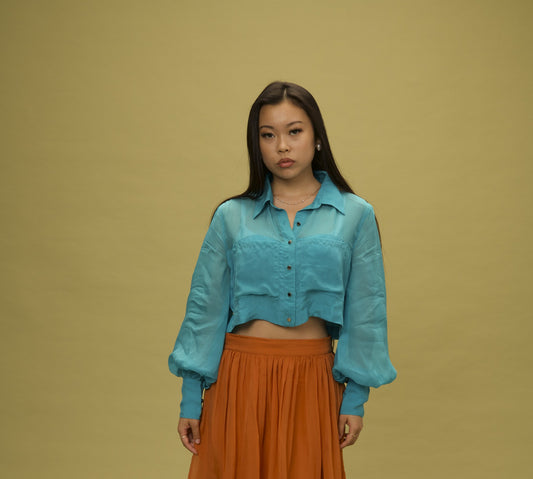 Organza Top, a sheer bamboo-cotton organza crop top in clear turquoise, by VALAJI MILANO.